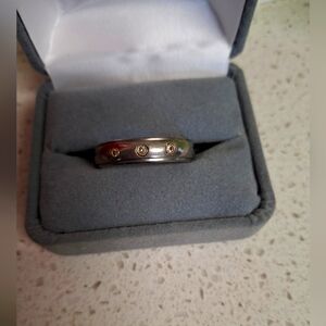 Mens Titanium Band with 3 Diamonds Mounted In 14 K yellow gold. Classy masculine